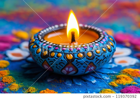 A beautifully painted diya with intricate designs, glowing brightly on a colorful floral background 119370392