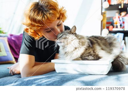 portrait red-haired attractive young woman with fluffy big cat portrait red-haired attractive young woman with fluffy big cat 119370978