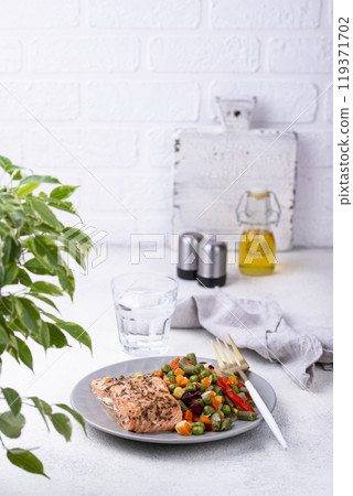 Baked salmon with boiled vegetable 119371702