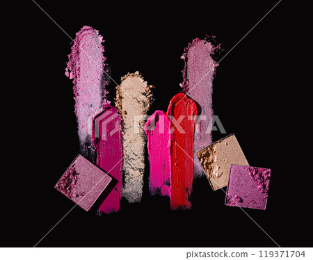 Different lipstick and eyeshadow smudge on black background 119371704