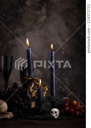 Halloween still life with skull, bones and cake Halloween still life with skull, bones and cake 119371721