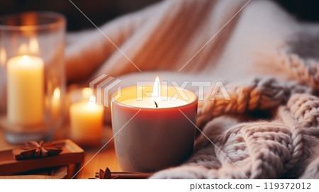 Warm Candlelit Atmosphere with Cozy Knit Blanket, Perfect for Winter Relaxation and Home Comfort 119372012