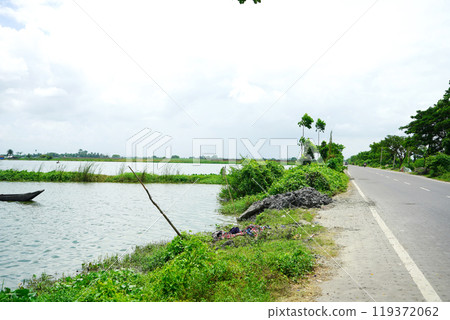 Road beside lake at Kharibari Near Kolkata 119372062