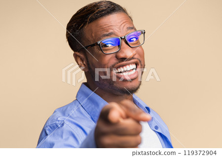 Hey, You. Cheerful African American Guy Pointing Finger At Camera Smiling Posing Over Orange Background. Studio Shot, Selective Focus Hey, You. Cheerful African American Guy Pointing Finger At Camera Smiling Posing Over Orange Background. Studio Shot, Selective Focus 119372904
