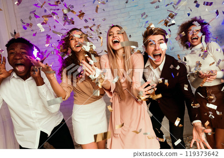 Party People. Excited Multiracial Friends Shouting Enjoying Falling Confetti Having Fun Celebrating New Year Indoor Party People. Excited Multiracial Friends Shouting Enjoying Falling Confetti Having Fun Celebrating New Year Indoor 119373642