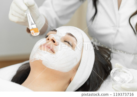 Experience relaxation and rejuvenation with a serene facial treatment session at the spa. A professional esthetician will provide pampering and skincare for your wellbeing and clear, glowing skin 119373716