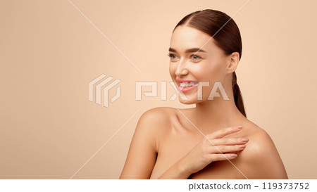 Bodycare. Happy European Young Lady Posing With Bare Shoulders, Touching Perfect Soft Skin And Looking Aside At Copy Space Over Light Gray Studio Background, Advertising Skin Care Offer. Panorama 119373752