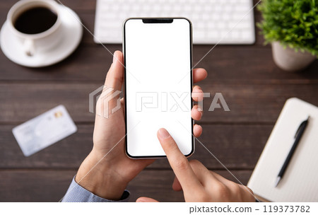 Man touching blank smartphone screen at workplace, mockup for application ar website, free space 119373782
