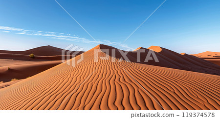 Sahara Desert wavy sand dunes in Morocco, blue sky background wallpaper backdrop. Sandy hills, travel, adventure, hot summer 119374578