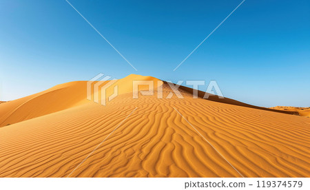 Sahara Desert wavy sand dunes in Morocco, blue sky background wallpaper backdrop. Sandy hills, travel, adventure, hot summer 119374579