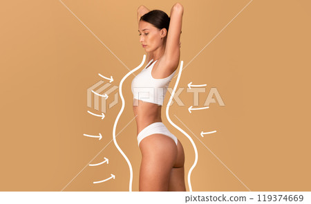 Liposuction concept. Drawn outlines with arrows around fit lady in white underwear, slender woman with perfect figure posing over beige studio background, collage Liposuction concept. Drawn outlines with arrows around fit lady in white underwear, slender woman with perfect figure posing over beige studio background, collage 119374669