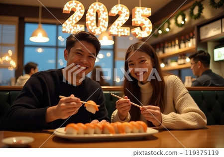 Asian man and woman having dinner in sushi restaurant with Christmas decorations 119375119