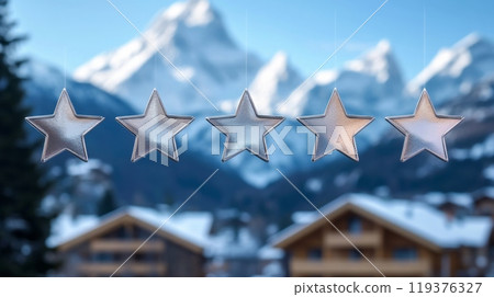 Five silver stars dangle against a backdrop of majestic snow-capped mountains and cozy wooden chalets. The winter landscape shines under clear skies, creating a serene and enchanting atmosphere. Five silver stars dangle against a backdrop of majestic snow-capped mountains and cozy wooden chalets. The winter landscape shines under clear skies, creating a serene and enchanting atmosphere. 119376327