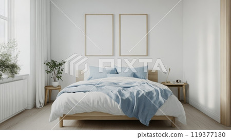 A cozy bedroom features a light wooden bed dressed in soft blue linens. Natural light floods the space through large windows, creating a calm ambiance complemented by potted plants. A cozy bedroom features a light wooden bed dressed in soft blue linens. Natural light floods the space through large windows, creating a calm ambiance complemented by potted plants. 119377180