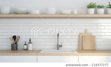 A sleek kitchen countertop is adorned with utensils, dishware, and greenery 119377277