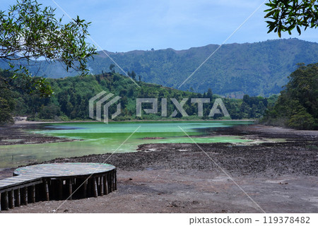 A stunning view of Telaga Warna, a colorful lake in Dieng Plateau, Indonesia. 119378482