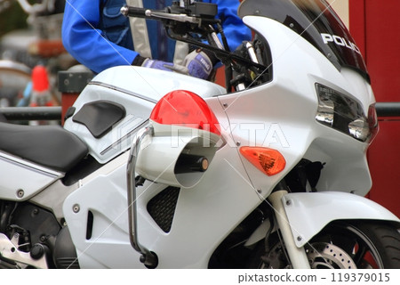A police motorcycle on patrol 119379015