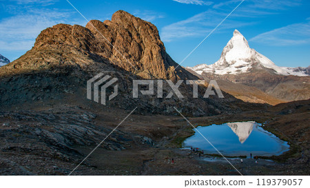 Upside-down Matterhorn reflected in Riffelsee, Zermatt, Switzerland Upside-down Matterhorn reflected in Riffelsee, Zermatt, Switzerland 119379057