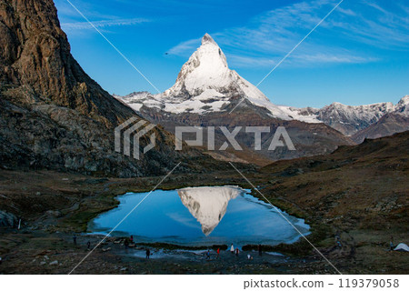 Upside-down Matterhorn reflected in Riffelsee, Zermatt, Switzerland Upside-down Matterhorn reflected in Riffelsee, Zermatt, Switzerland 119379058