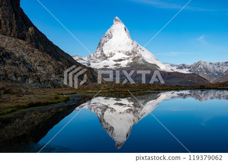 Upside-down Matterhorn reflected in Riffelsee, Zermatt, Switzerland Upside-down Matterhorn reflected in Riffelsee, Zermatt, Switzerland 119379062