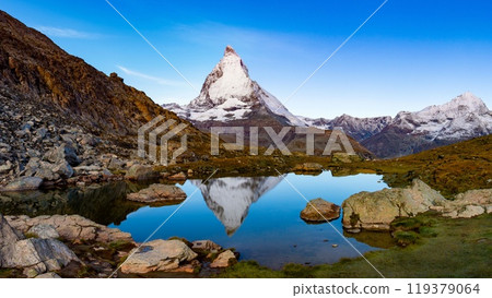 Upside-down Matterhorn reflected in Riffelsee, Zermatt, Switzerland Upside-down Matterhorn reflected in Riffelsee, Zermatt, Switzerland 119379064