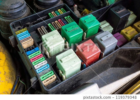 Close-up of old automotive fuse kit for controlling various vehicle systems. Select focus Close-up of old automotive fuse kit for controlling various vehicle systems. Select focus 119379348