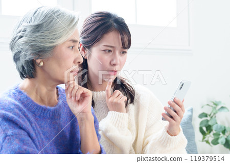 Smartphone trouble: Grandma and grandson 119379514