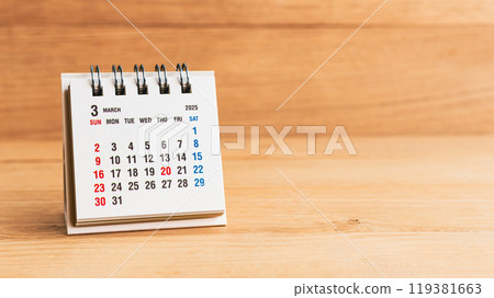 March 2025 calendar on wood background 119381663