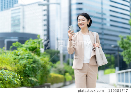 Middle-aged business woman working in an office district 119381747