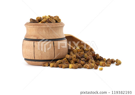 Natural bee bread in a charming wooden container with a scoop 119382193