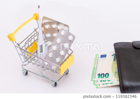 Pills and Capsules in a Shopping Cart and Black Wallet with Euro Money Pills and Capsules in a Shopping Cart and Black Wallet with Euro Money 119382346