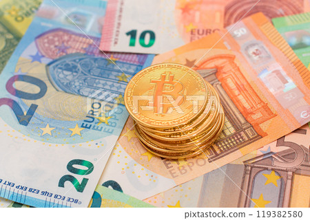 A Stack of Bitcoin Coins on the Euro Banknotes 119382580