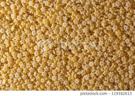 Uncooked Stelline Pasta Background 119382613