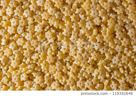 Uncooked Stelline Pasta Background Uncooked Stelline Pasta Background 119382646