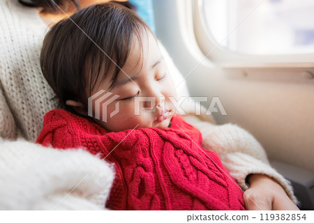 Baby sleeping on public transport 119382854