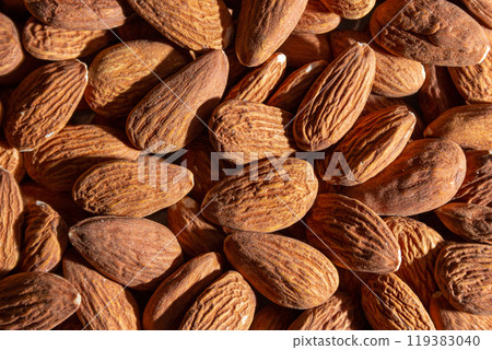 Scattered Almonds. Background from Almond Nuts Scattered Almonds. Background from Almond Nuts 119383040