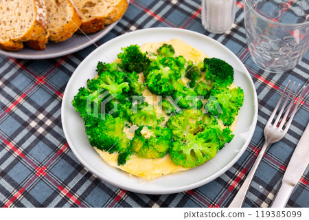 Omelette with broccoli served on plate 119385099