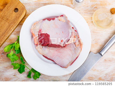 Pieces of raw thick beef steaks 119385205