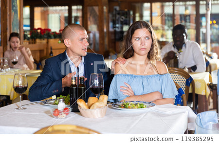Young couple man and woman quarreling in restaurant 119385295