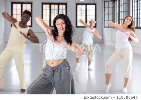 dancers training in a dance studio 119385647