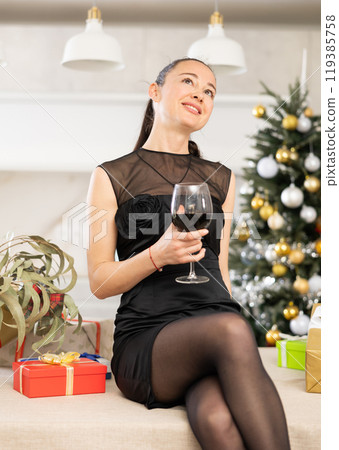 girl resting in kitchen among New Year s gifts girl resting in kitchen among New Year s gifts 119385758