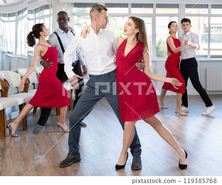 Adult man and young woman dancing tango 119385768