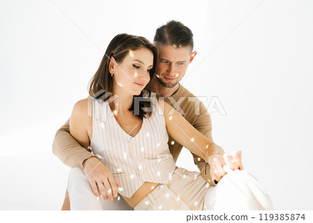 Young man and a woman smiling and seem to be enjoying each other's company Young man and a woman smiling and seem to be enjoying each other's company 119385874