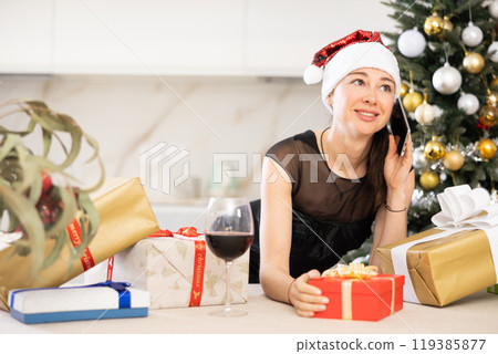 girl in New Year s atmosphere speaks on phone 119385877