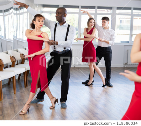 Adult man and adult woman dance tango 119386034