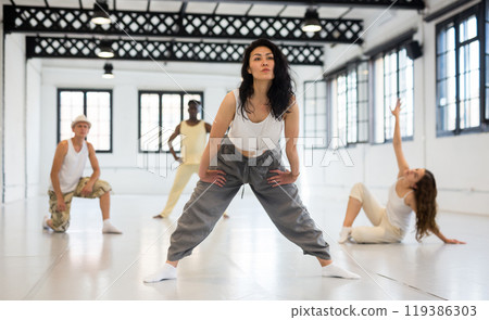 Asian woman studying movement of contemporary dance 119386303