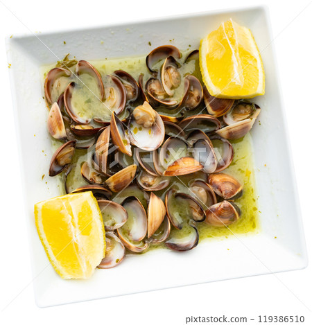 Delicious lemon herb clams served in white bowl Delicious lemon herb clams served in white bowl 119386510