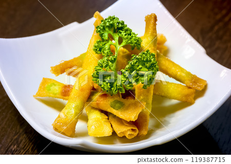 Crispy and delicious edamame cheese spring rolls 119387715