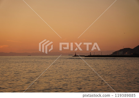 A sunset lighthouse 119389885