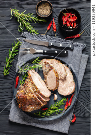 Roast Pork Neck sliced on a plate, top view 119389941